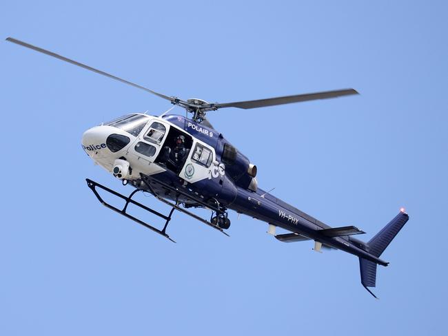 SYDNEY, AUSTRALIA - NewsWire Photos. December 1, 2020. NSW Police helicopter POLAIR 9 flies over the CBD.  Sydney, NSW. Picture: NCA NewsWire / Dylan Coker