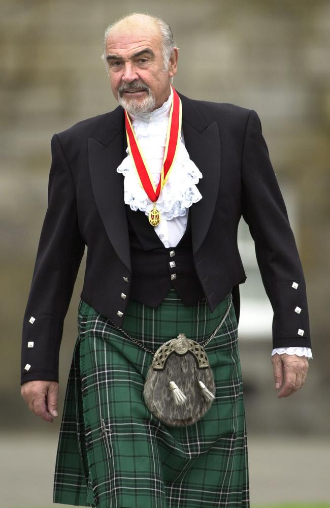 Sir Sean Connery in Highland dress and wearing his medal after he was formally knighted by Queen Elizabeth II in 200 in his home city of Edinburgh. Picture: AP Photo/ David Cheskin/WPA pool.