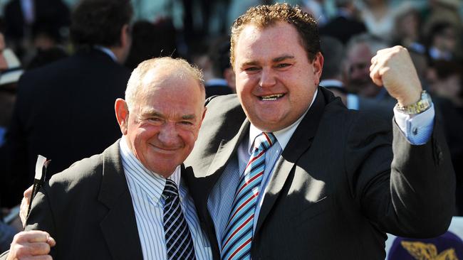 Troy Corstens celebrates with dad Leon after Starspangledbanner won the Caulfield Guineas in 2009.