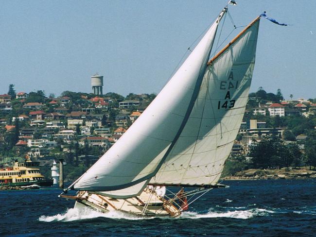 A gaff-rigged cutter competes in the classic yachts division of the Australia Day Regatta.