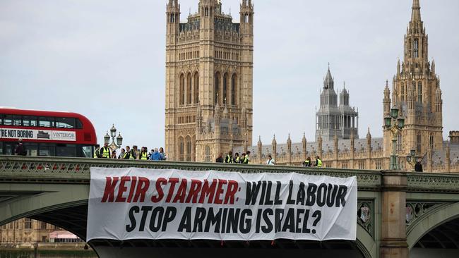 An anti-Israel banner is hung over the side of Westminster Bridge, in front of the British Houses of Parliament, in June before the following month’s general election. Picture: AFP