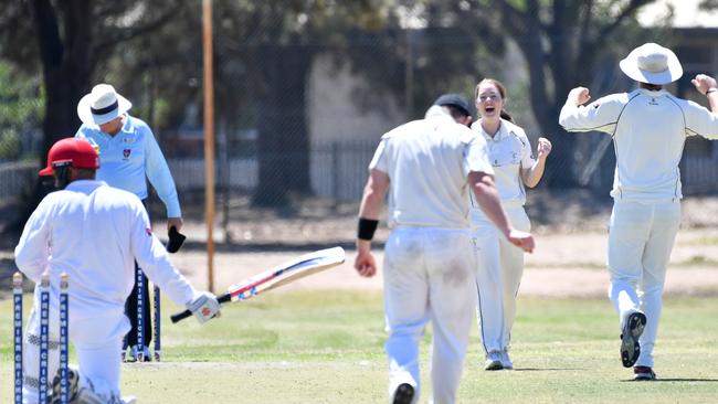 Amanda Jade Wellington takes one of her three wickets in Port Adelaide’s men’s D grade on Saturday. Picture: AAP/Keryn Stevens