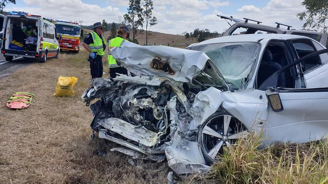 HORROR HEAD-ON: A man who was trapped in his car (pictured) after it crashed head-on with another car on the Wide Bay Highway is still in a serious condition in hospital. Photo: Frances Klein