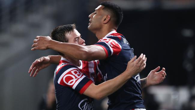 Luke Keary and Daniel Tupou celebrate after combining for the Roosters’ opening try. Picture: Getty Images