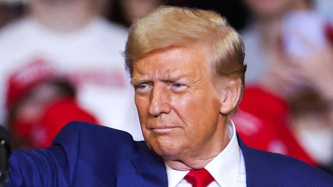 Former US President and Republican presidential candidate Donald Trump leaves the stage after a campaign rally at the Bryce Jordan Center in State College, Pennsylvania, October 26, 2024. (Photo by Charly TRIBALLEAU / AFP)