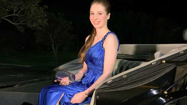 Wearing a stunning dress and smile, Phillipa Rossi arrived in a horse drawn carriage at the St Mary's College formal.