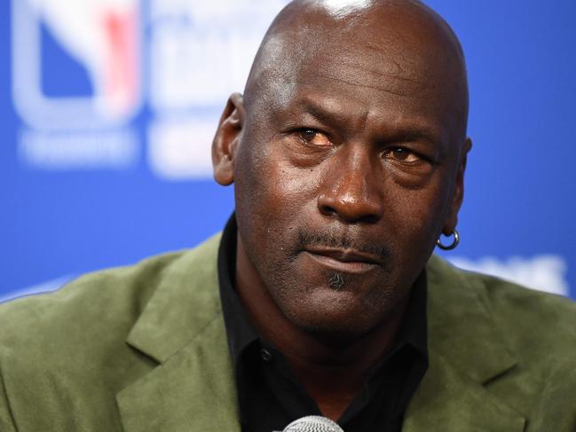 (FILES) In this file photo taken on January 24, 2020 former NBA star and owner of Charlotte Hornets team Michael Jordan looks on as he addresses a press conference ahead of the NBA basketball match between Milwaukee Bucks and Charlotte Hornets at The AccorHotels Arena in Paris. - Michael Jordan said June 5, 2020, he is making a record $100 million donation to groups fighting for racial equality and social justice amid a wave of protests across the United States. (Photo by FRANCK FIFE / AFP)