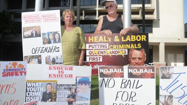 Anti-crime advocates Humphrey Hollins and Perri Conti also erected protest corflutes outside the Cairns Court House complex on Sheridan St last week, demanding action on youth crime from the state government. Picture: Peter Carruthers