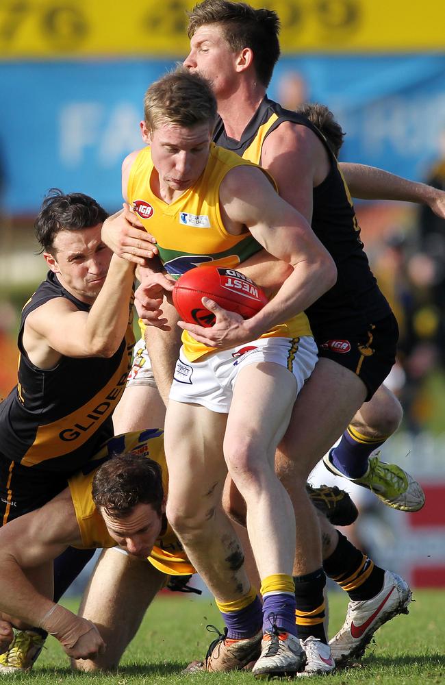 Woodville West Torrens’ Joe Sinor bursts through the pack. Picture: CALUM ROBERTSON