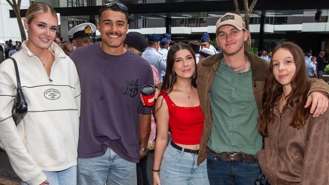 Thousands of people have braved the rain to gather in Brisbane for Anzac Day services. Picture: Grace Kessels