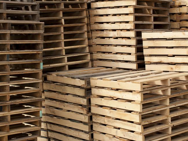 Wood shipping pallets stacked high