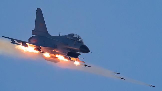 A Chinese J-10 fighter jet fires at mock ground targets during a recent training exercise. Picture: People’s Liberation Army