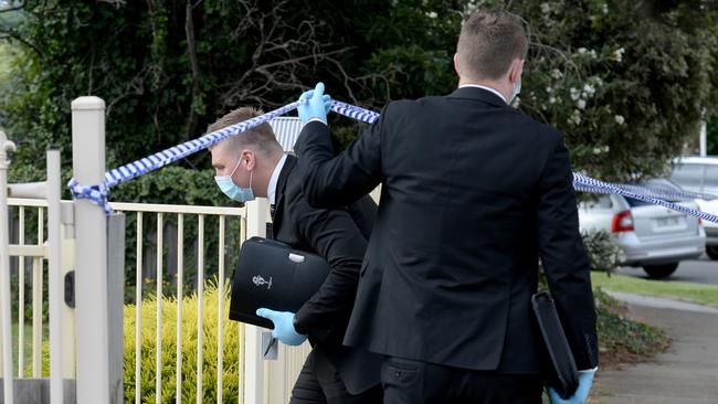 Detectives enter the property. Picture: Andrew Henshaw