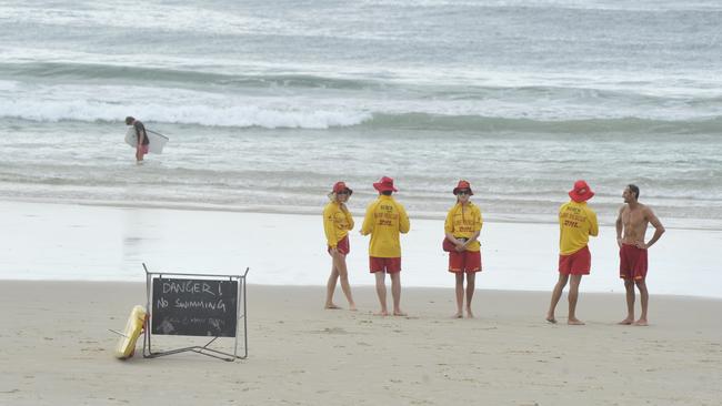 Signs warning of dangerous surf conditions at Main Beach, Byron Bay in a file photo. Picture: Cathy Adams