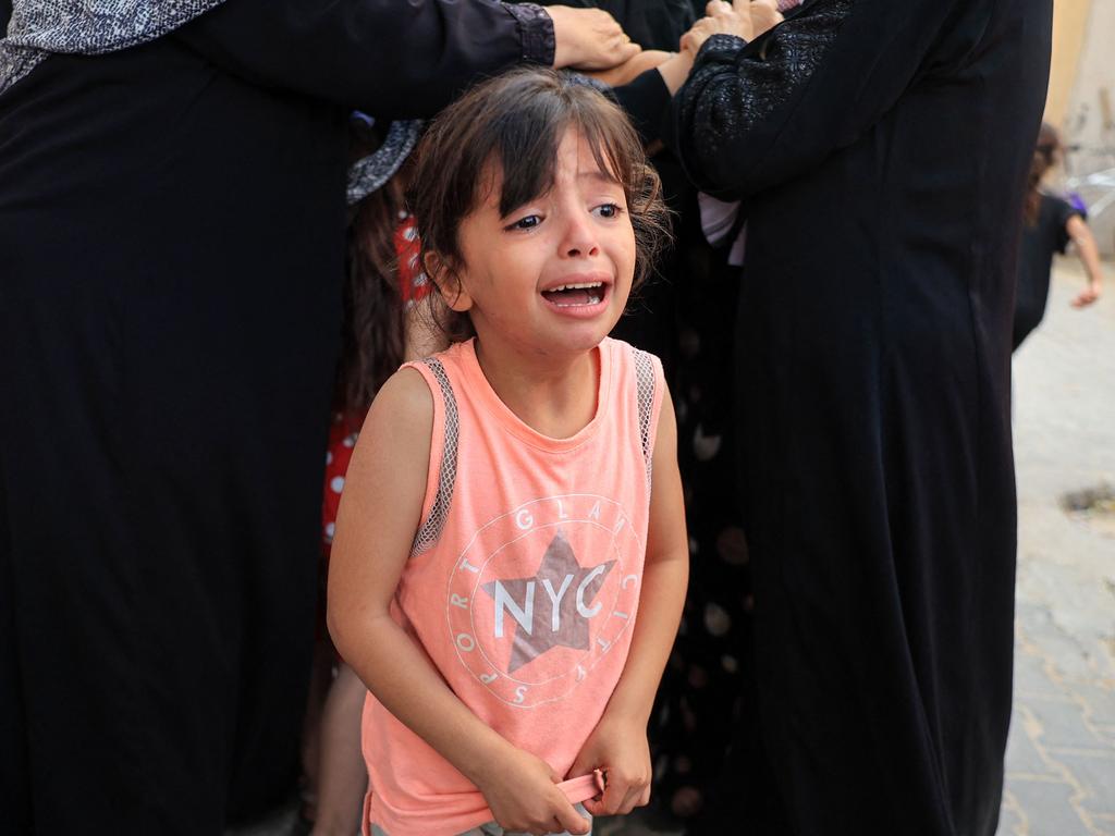 A grieving child during the funeral of members of the Abu Quta family, who were killed in Israeli strikes on the Palestinian city of Rafah. Picture: Said Khatib/AFP