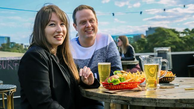 Lauren Gravas and Mitchell Semark enjoy a meal and a drink at Mary’s On top. Picture: Jenifer Jagielski