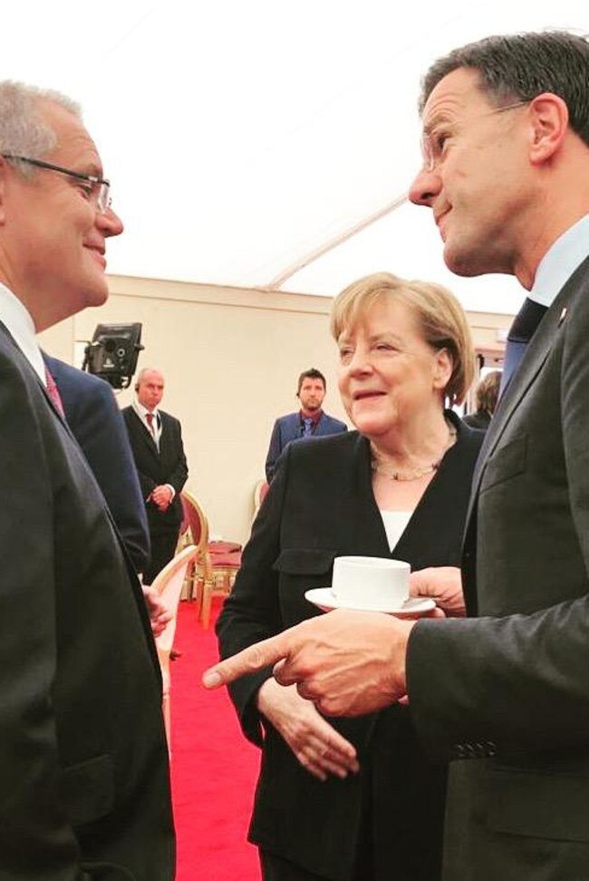 Australian PM Scott Morrison, German Chancellor Angela Merkel and Dutch PM Mark Rutte at an event to commemorate the 75th anniversary of D-Day, in Portsmouth, Britain on Wednesday.