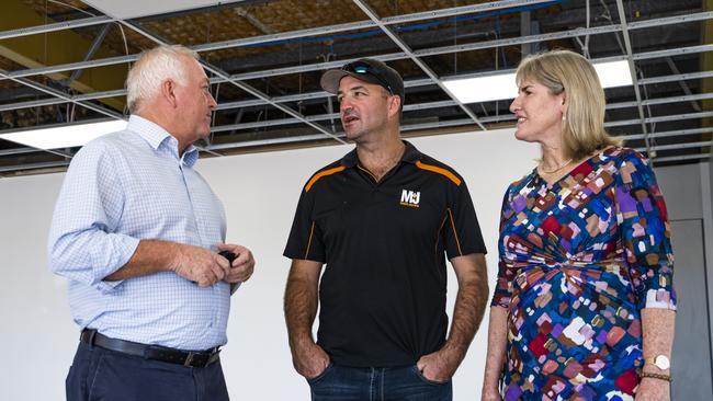 Master Builders NT's Dave Malone, M+J Builders owner Michael "Mick" Buckley, and Minister Eva Lawler at a construction site in Stuart Park discussing new building reforms. Picture: Mitch Drescher/ NT Govt