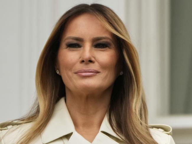 President Donald Trump and first lady Melania Trump stand on the Blue Room Balcony as they participate in the White House Easter Egg Roll being held on the South Lawn of the White House, Monday, April 21, 2025, in Washington. (AP Photo/Mark Schiefelbein)