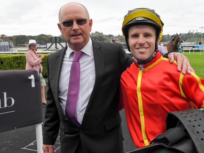 Jockey Tommy Berry is seen in the mounting yard with trainer Toby Edmonds (left) after riding Winter Bride to victory in race 1, the Wenona Girl Quality during Randwick Guineas Day at Royal Randwick Racecourse in Sydney, Saturday, March 9, 2019. (AAP Image/Simon Bullard)