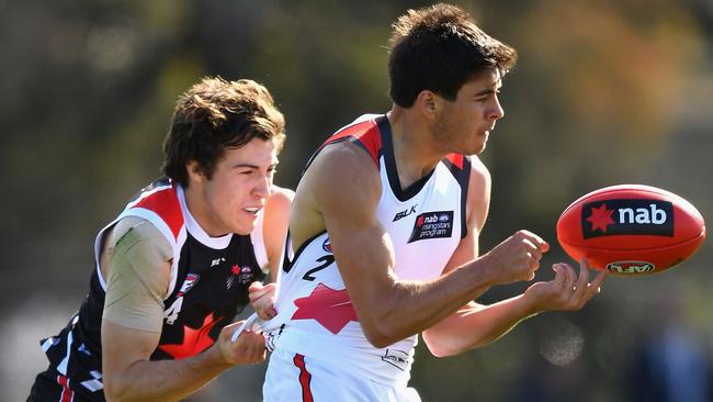 Ben Jarman handballs under pressure during a NAB all stars under-18 match at Punt Road Oval. (Photo by Quinn Rooney/Getty Images)