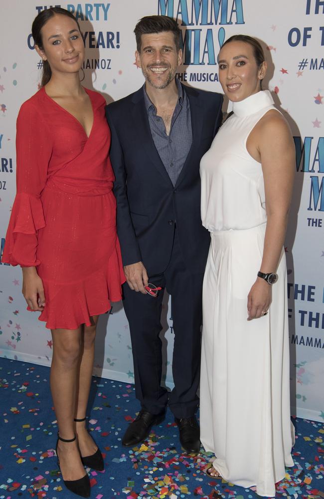 Osher Gunsberg (centre) with wife, Audrey, far right,