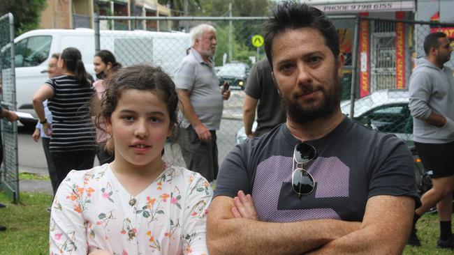 Max Phillips with his daughter. Mr Phillips started a petition to install lights on the crossing. Picture: Alexi Demetriadi