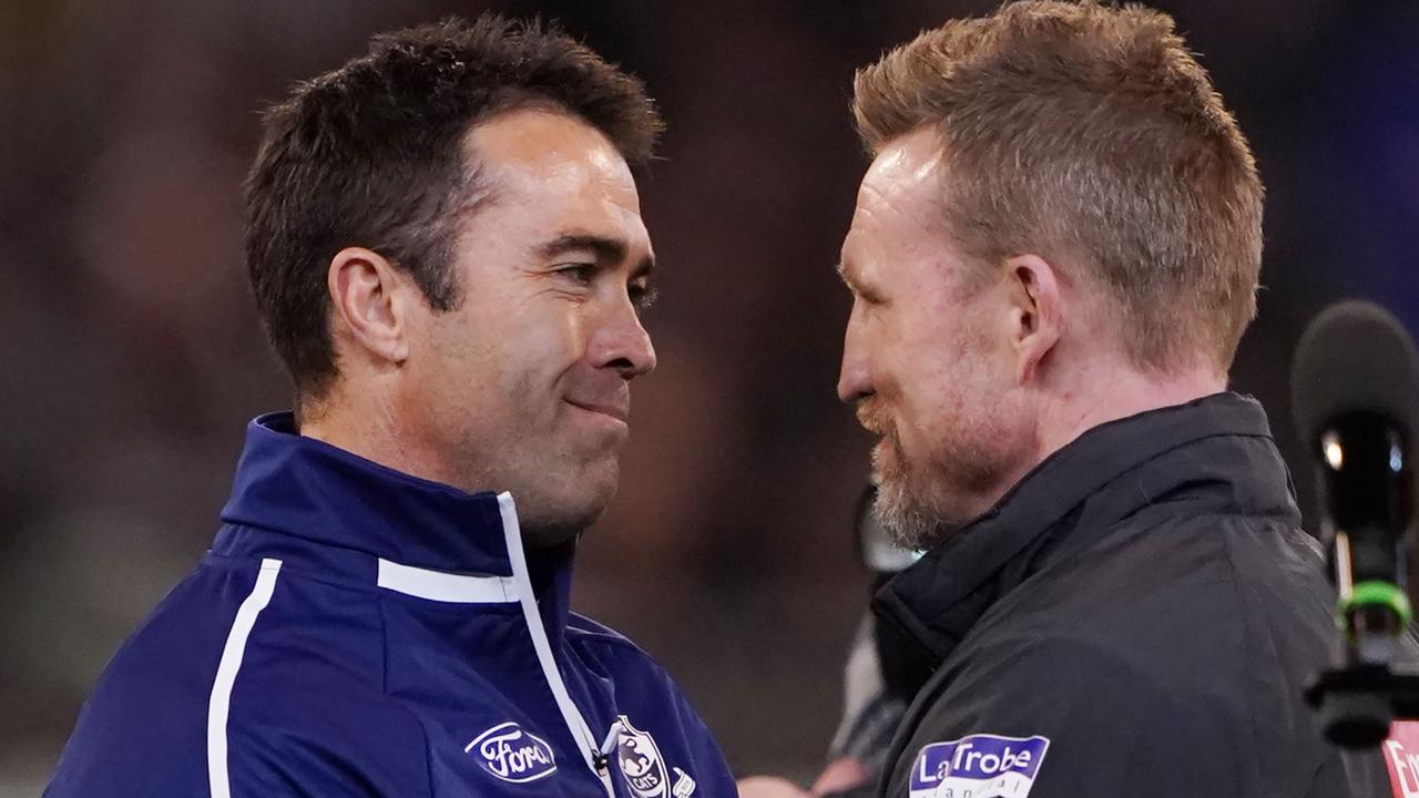 Cats head coach Chris Scott and Magpies head coach Nathan Buckley. Picture: Michael Dodge