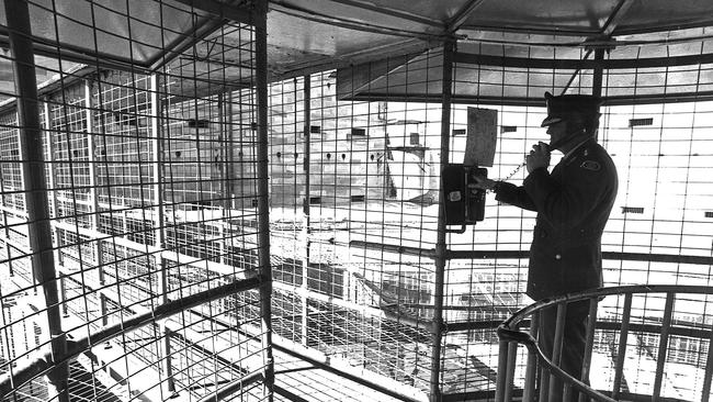 A guard keeps watch of the jail in the 1970s.