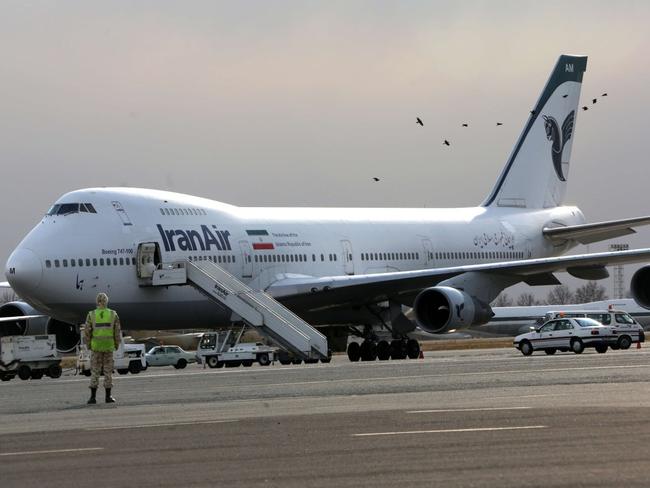 Iran plans to buy 114 commercial aircraft from European plane maker Airbus re renovate its aging fleet of aircraft. Above a picture from 2013 shows an Iran Air Boeing 747 passenger plane on the tarmac of Mehrabad airport in the Iranian capital Tehran. PHOTO: BEHROUZ MEHRI/AGENCE FRANCE-PRESSE/GETTY IMAGES