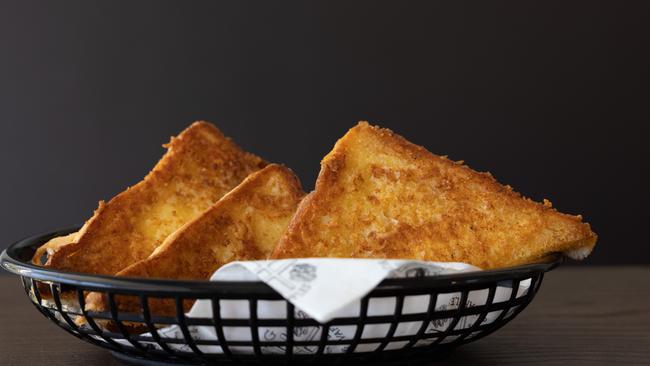 Cheezy toast at Hash Tag Burgers and Waffles in Ashgrove. Picture: David Kelly