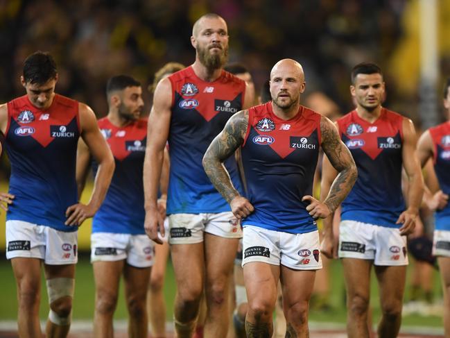 Nathan Jones (centre) leads the Demons from the ground after the Round 6 AFL match between the Richmond Tigers and the Melbourne Demons at the MCG in Melbourne, Wednesday, April 24, 2019. (AAP Image/Julian Smith) NO ARCHIVING, EDITORIAL USE ONLY