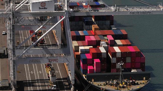 A shipping container is lifted off a container ship docked at the Port of Oakland on April 28, 2025 in Oakland, California. Imports has led US GDP to fall. (Photo by JUSTIN SULLIVAN / GETTY IMAGES NORTH AMERICA / Getty Images via AFP)