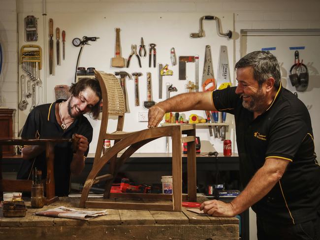 Third year apprentice cabinet maker Kane Gough (l) with his employer Garry McLaughlin (r) at work at GarryÃs furniture restoration business workshop in Queanbeyan, New south Wales. Picture by Sean Davey.