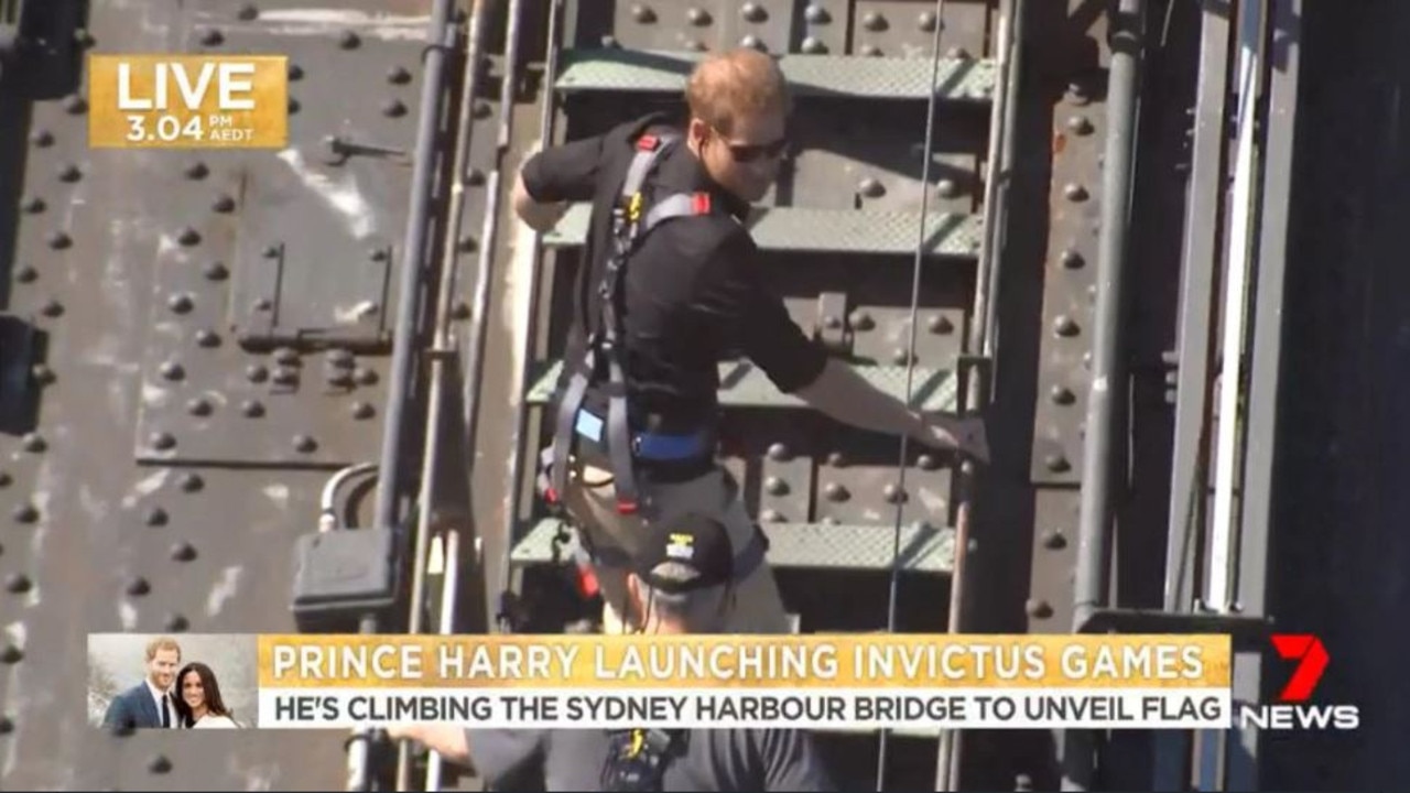 Prince Harry begins his climb of the Sydney Harbour Bridge.