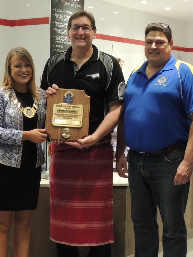 Hills Shire Mayor Yvonne Keane and Castle Hill Lions President Stephen Scotney present Matthew Wright with the Melvin Jones Fellowship Award