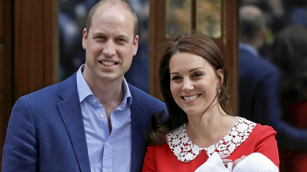 NOT IMPRESSED: Britain's Prince William and Kate, Duchess of Cambridge pose for a photo with their baby son. Picture: Kirsty Wigglesworth