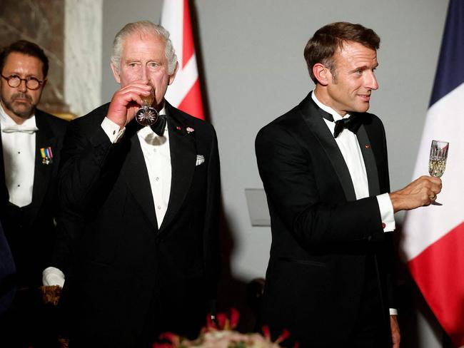 The King takes a swig. Picture: AFP