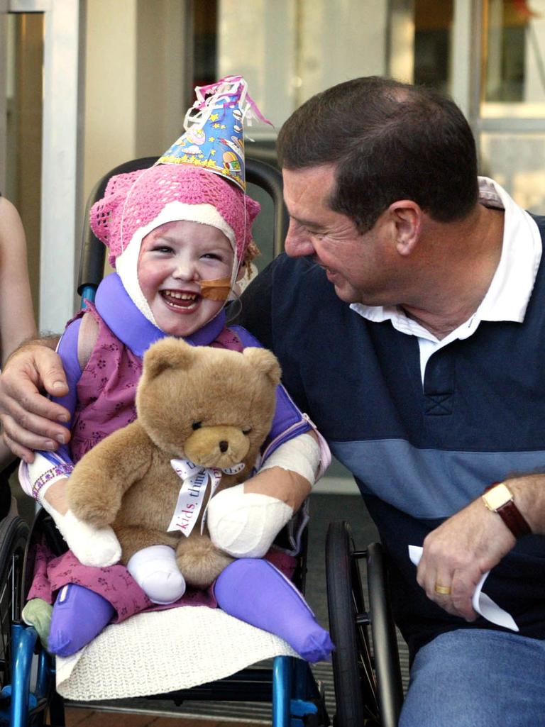 Delezio leaving hospital in 2004, six months after she was injured at her daycare centre. Picture: Marc McCormack.