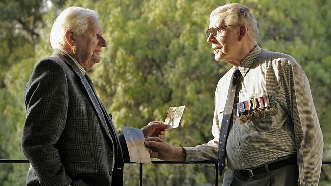 Jack Caple, 95, with Don Tibbits, 89, remembering their fallen comrades. Picture: VALERIU