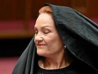 STUNT? One Nation senator Pauline Hanson removes the burqa. Picture: LUKAS COCH