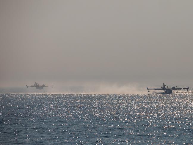 Sea planes have been spotted doing water runs to the Pacific to fight the fire. Picture: Apu Gomes / GETTY IMAGES NORTH AMERICA / Getty Images via AFP