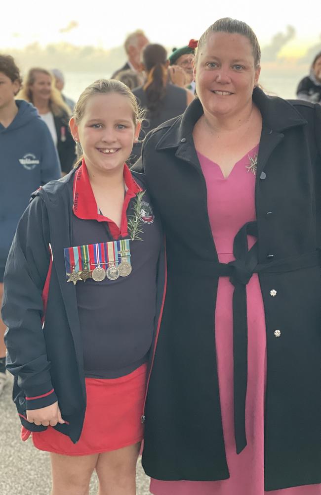 Millie and Nell Thomsett at the Half Tide Dawn Service at Hay Point. Millie is wearing a replica set of her great grandfather's WWII medals. Mackay Anzac Day 2025. Photo: Janessa Ekert
