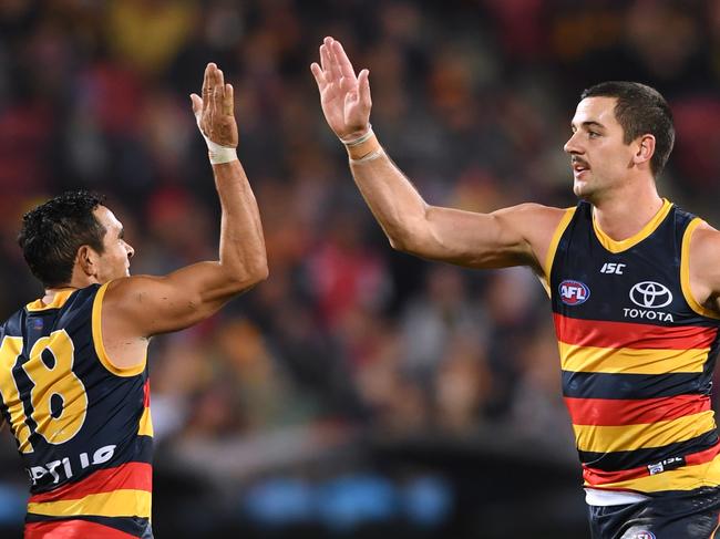 ADELAIDE, AUSTRALIA - JUNE 13: Taylor Walker of the Adelaide Crows celebrates a goal with Eddie Betts of the Adelaide Crows during the round 13 AFL match between the Adelaide Crowd and the Richmond Tigers at Adelaide Oval on June 13, 2019 in Adelaide, Australia. (Photo by Mark Brake/Getty Images)