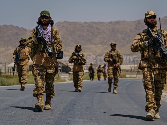 Taliban fighters secure the outer perimeter, alongside the American controlled side of the Hamid Karzai International Airport in Kabul, Afghanistan. Picture: AFP