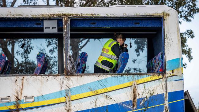 Police investigators photograph the bus on Wednesday. Picture: Jake Nowakowski