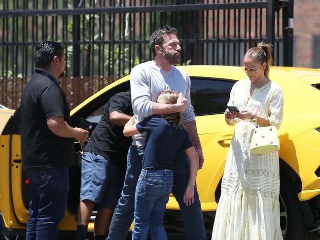 Ben Affleck, centre, comforts his son Samuel after the incident, as Jennifer Lopez looked on. Picture: Juliano/X17online.com