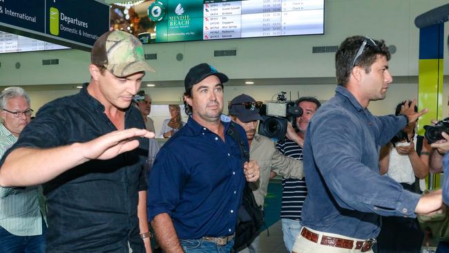 Matt Wright arrives in Darwin flanked by security to present himself to NT Police to face charges relating to the fatal accident that killed his friend and co-star Chris Wilson