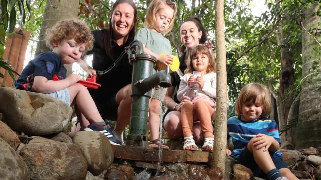 Head Start Children’s Centre Currumbin Waters director Renee Haig-Greenwood with staff member Chelsea and children they care for. Picture: Glenn Hampson