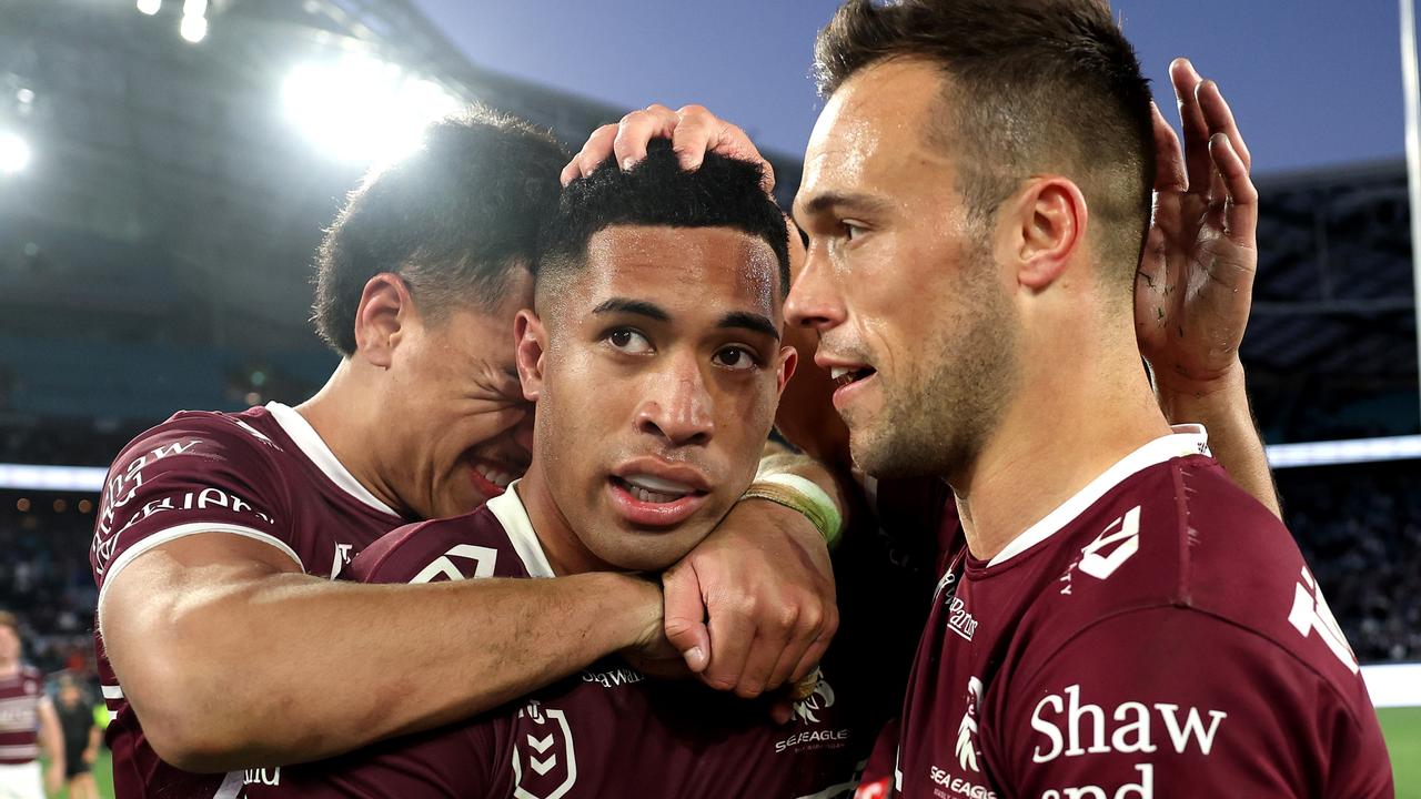 SYDNEY, AUSTRALIA - SEPTEMBER 15: Lehi Hopoate of the Sea Eagles, Tolutau Koula of the Sea Eagles and LukeÃ&#130;Â Brooks of the Sea Eagles embrace after winning during the NRL Qualifying Final match between Canterbury Bulldogs and Manly Sea Eagles at Accor Stadium on September 15, 2024 in Sydney, Australia. (Photo by Cameron Spencer/Getty Images)